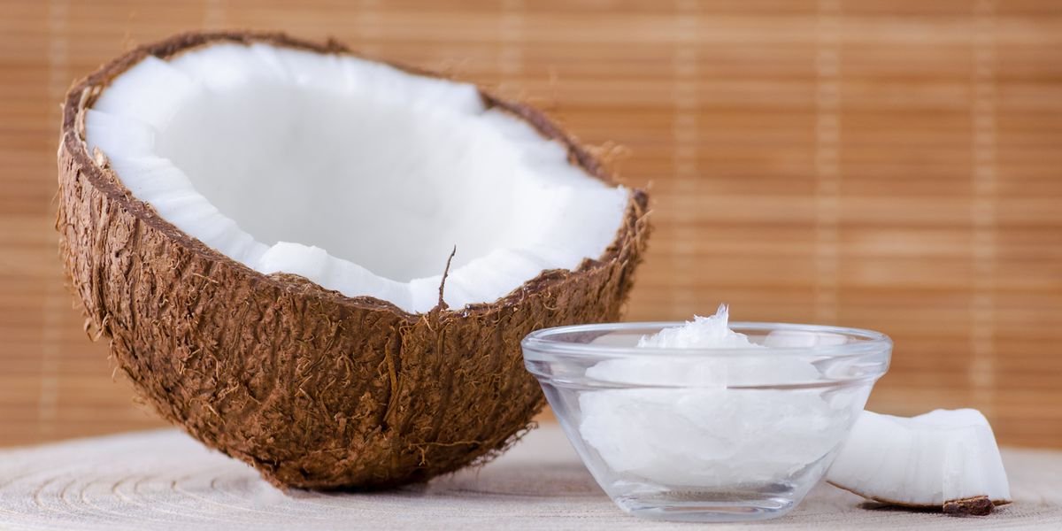organic-coconut-oil-in-a-glass-bowl-and-coconut-on-royalty-free-image-891373694-1553109072.jpg